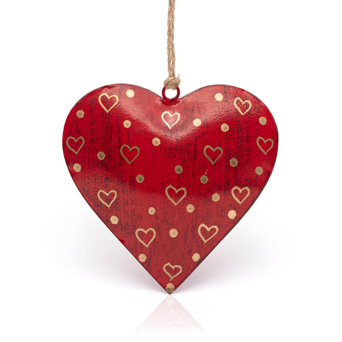 Red hanging heart with gold hearts and spots.