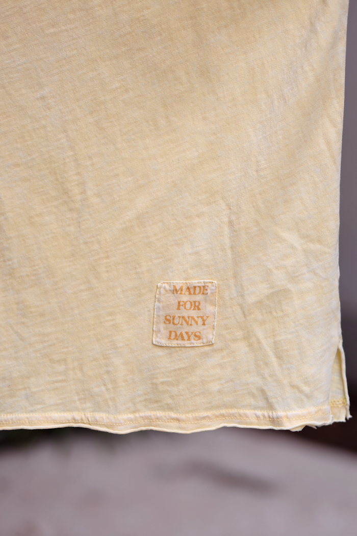Light yellow cotton shirt with 'Made for Sunny Days' patch, perfect for warm weather style.