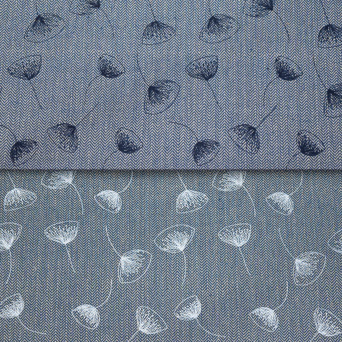 A close-up of fabric with a fine herringbone texture, featuring a floral pattern. The top half shows dark blue flowers, while the bottom half shows white flowers.