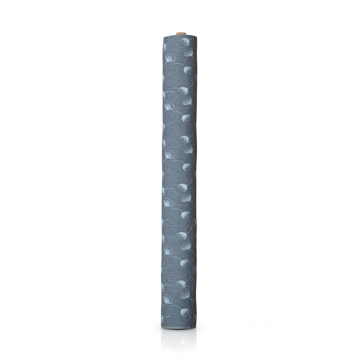 Blue with white flower fabric standing vertically on a roll, on a white background.