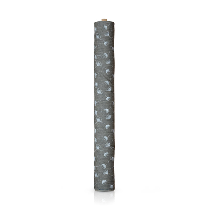 Black herringbone fabric on a roll.