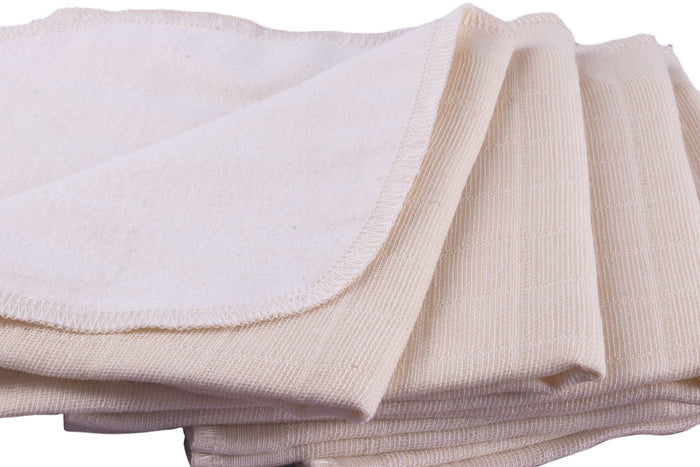 close-up of undyed unbleached organic cotton double sided facecloth with smooth side and rough side
