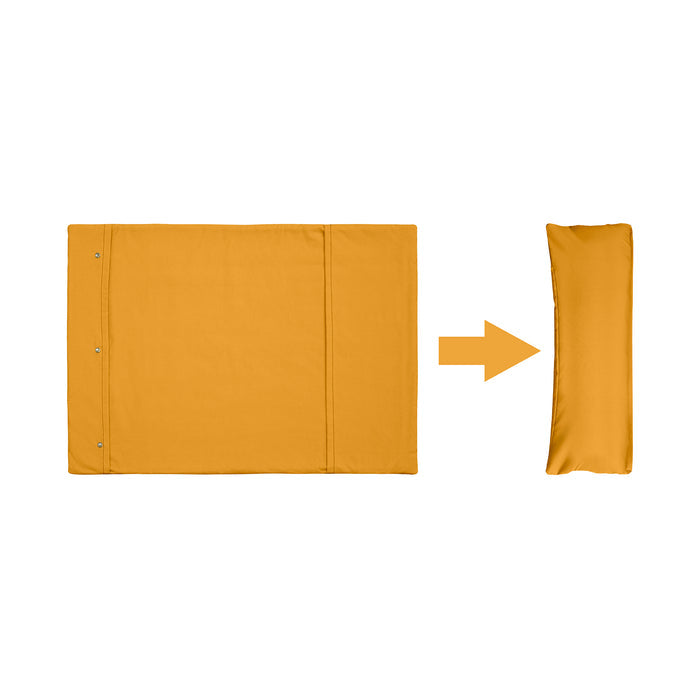 A yellow Chimney Sheep woollen travel rollup dog bed sat on a white background. This graphic illustrates how the flat rectangular woollen travel bed can be rolled up and transformed into a packaway lightweight travel dog bed.