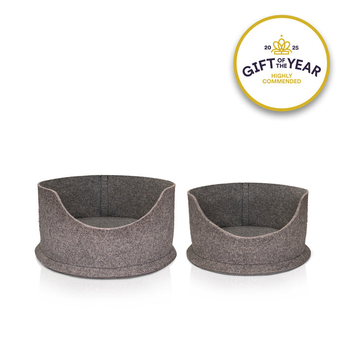 Two grey felt snug pet beds on a white background with a 'Gift of the Year' award badge.