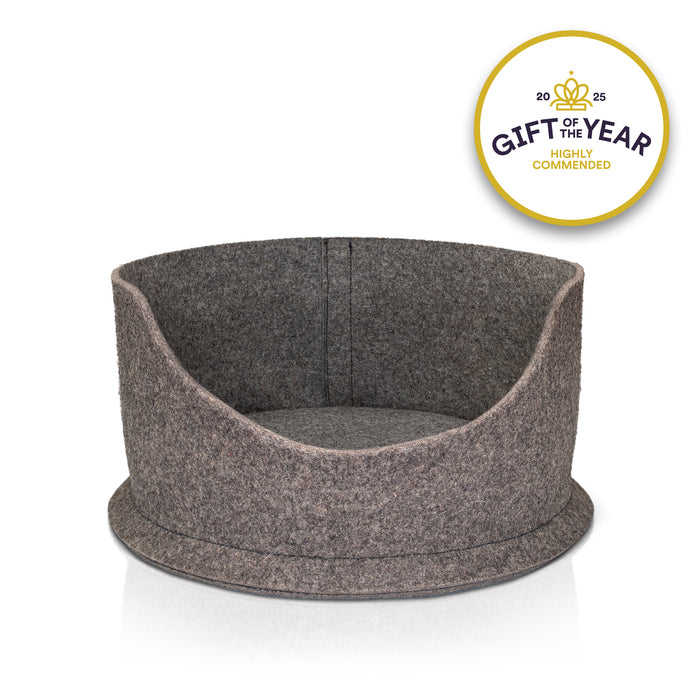 Grey wool felt snug pet bed with 'Gift of the Year' award badge on a white background