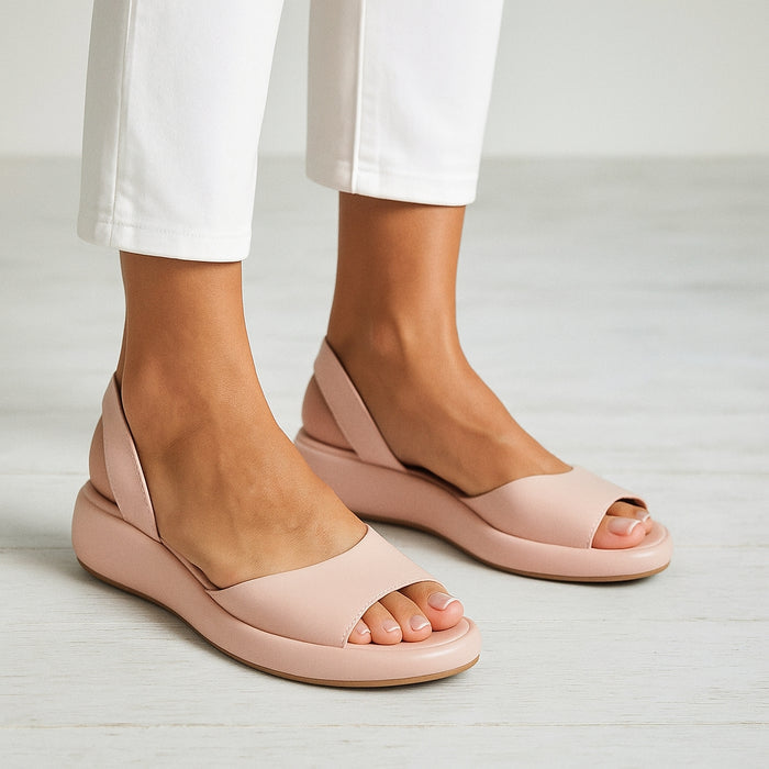 Open-toe slingback flat sandals in pink, front view