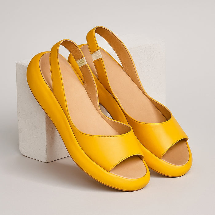 Open-toe slingback flat sandals, angled pair view