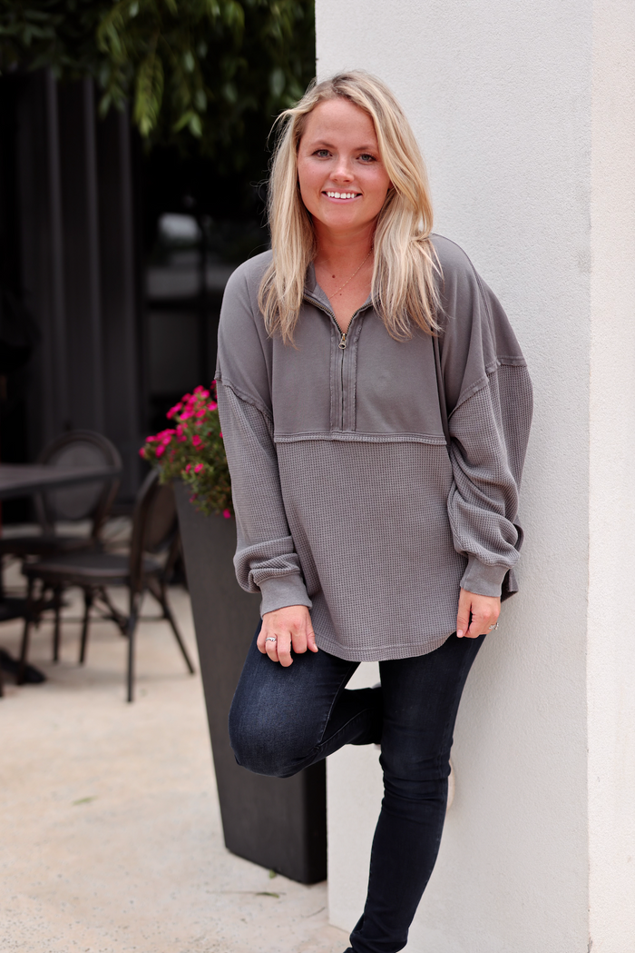 Cozy gray zip-up pullover sweatshirt, lightweight waffle knit fabric, perfect for casual wear.