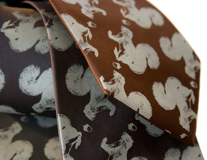 Squirrel ties. Dove gray ink on black, dark brown.