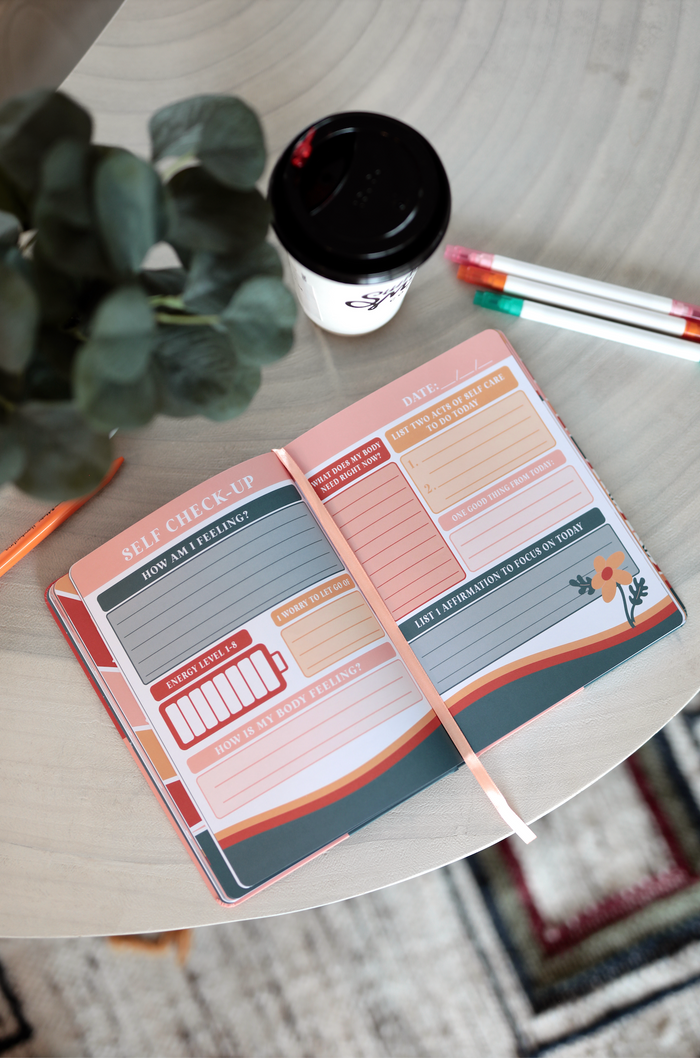 Self-care journal with prompts, featuring a pink and green design, perfect for daily reflection and wellness.