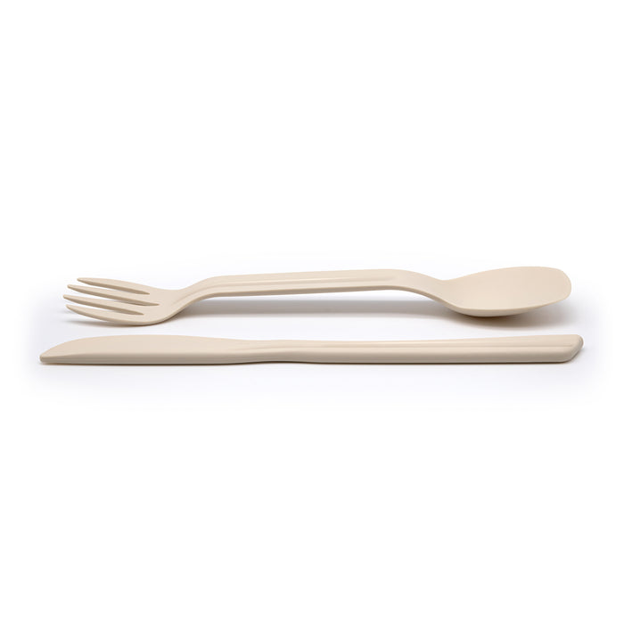 Eco-friendly spork and knife laid out on a white background.