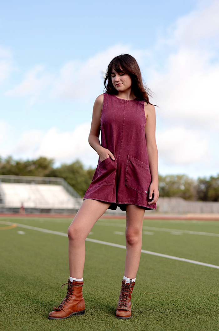 Casual maroon sleeveless dress with pockets, perfect for summer wear, paired with brown lace-up boots.