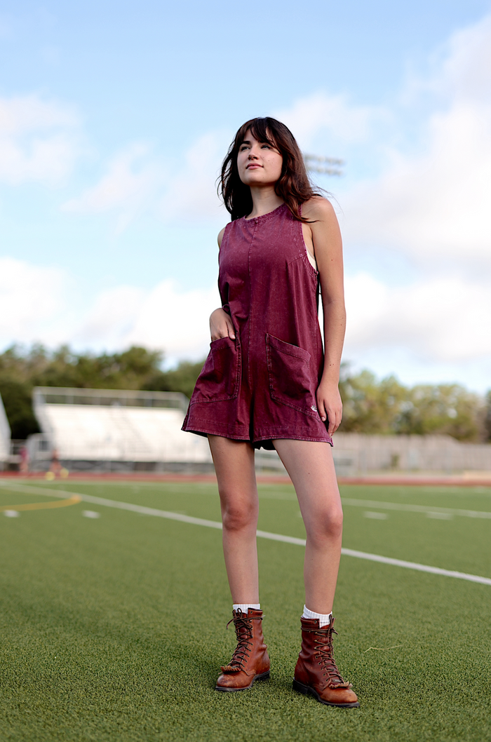 Burgundy sleeveless romper with pockets, perfect for casual outings and warm weather.