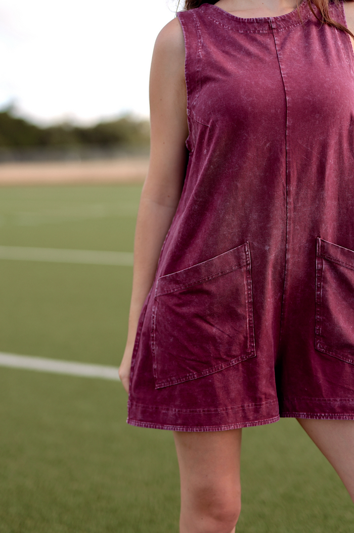 Burgundy sleeveless denim romper with pockets, perfect for casual wear and summer outings.