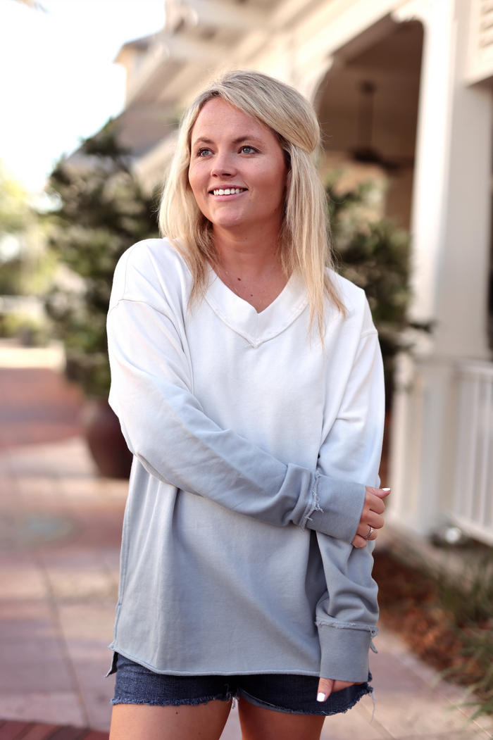 Casual women's long-sleeve color-block top in white and grey, made from soft cotton for comfortable wear.
