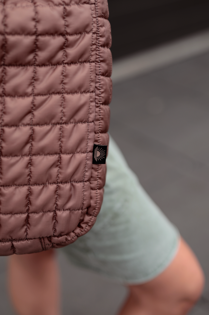 Brown quilted bag made from lightweight material, ideal for casual outings and day trips.