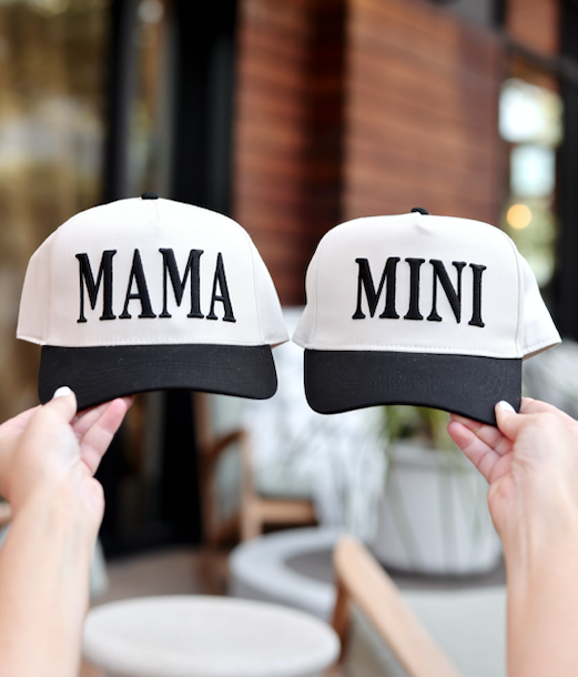 Matching 'Mama' and 'Mini' baseball caps in beige and black, perfect for family outings.