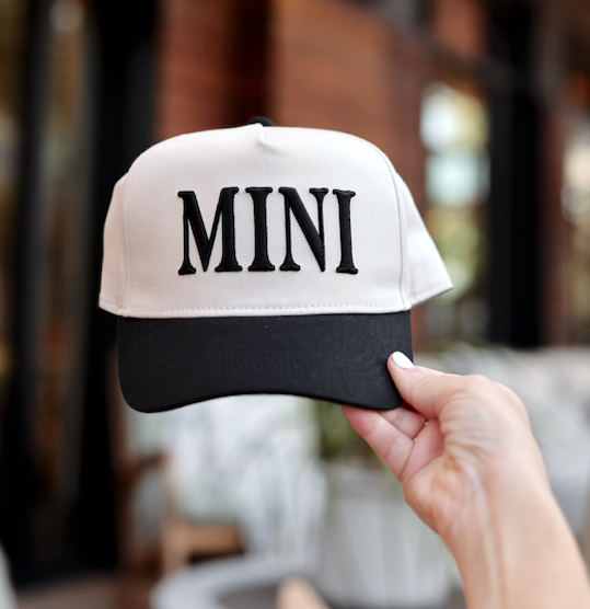 Stylish kids' cap in cream and black with 'MINI' embroidered. Perfect accessory for trendy outfits.
