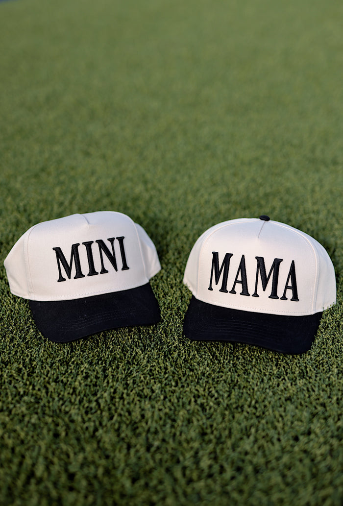 Matching beige and black caps saying 'MINI' and 'MAMA', perfect for family outings.