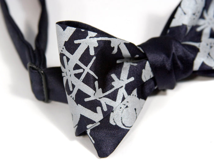 Pale gray ink on navy.