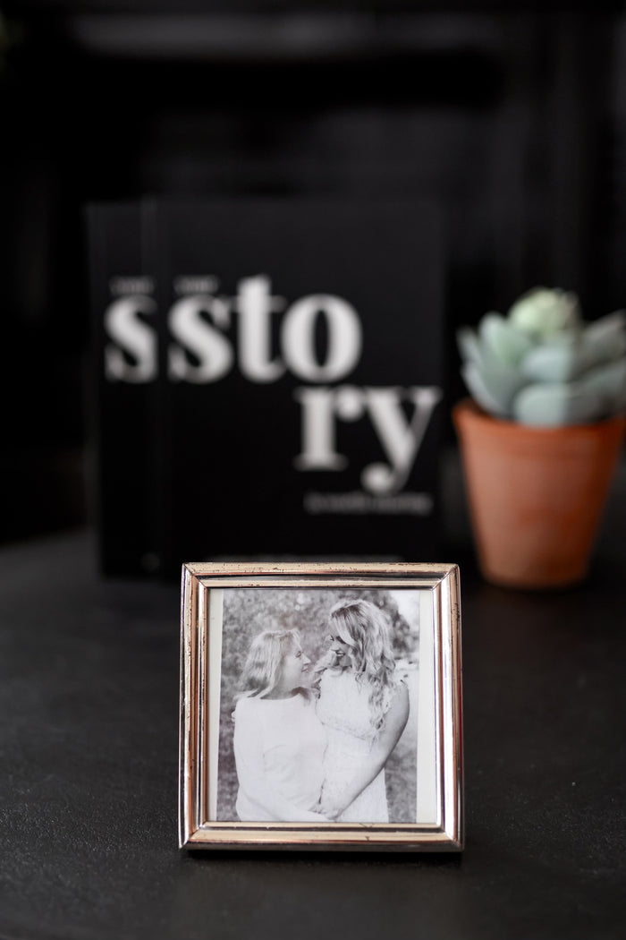 Elegant silver photo frame displaying a black-and-white picture of two women, perfect for cherished memories.